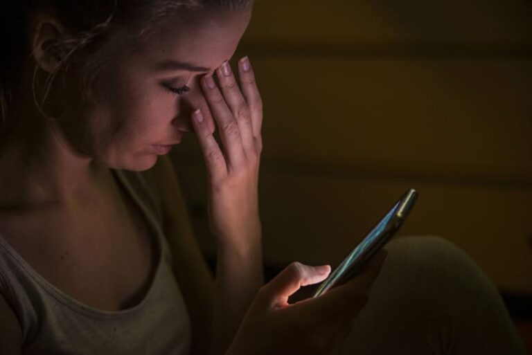 A woman looking at her phone