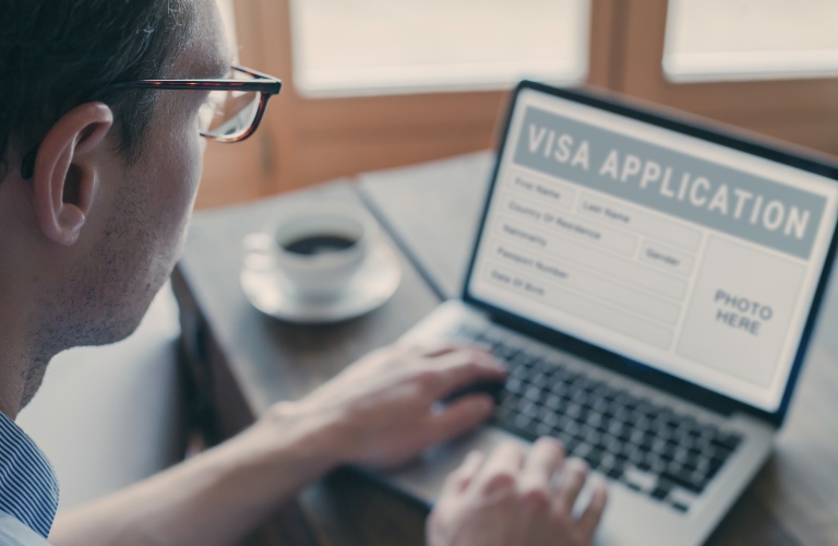man filling form for Online visa application