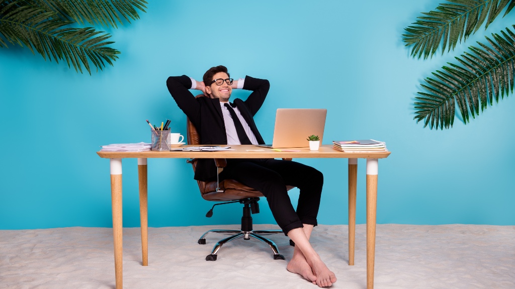 positive man sitting table tired dream about perfect summer vacation