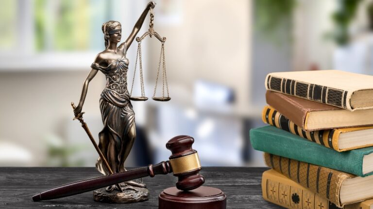 judge's wooden gavel and books